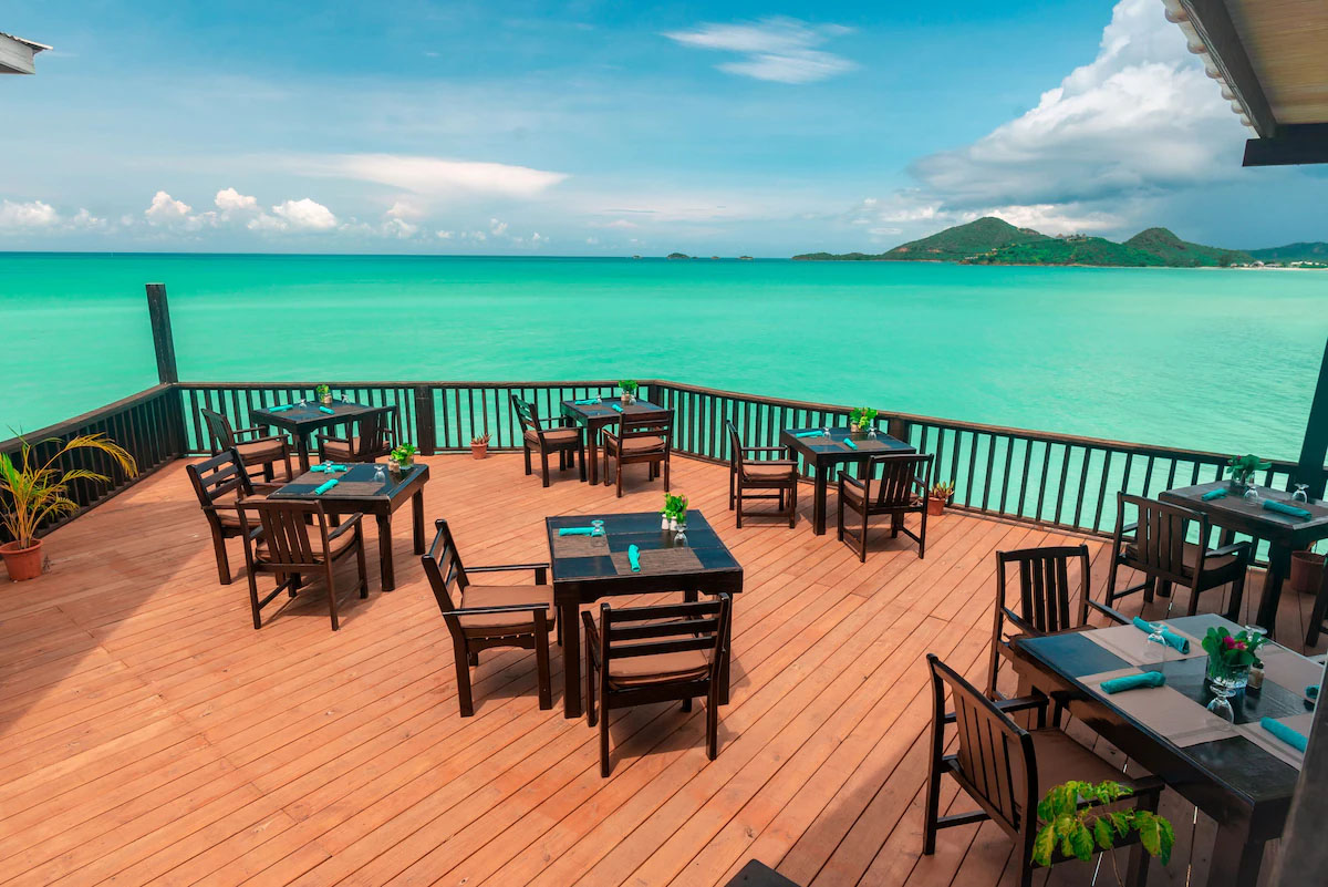 Cocos Hotel's dining area overlooking the ocean.