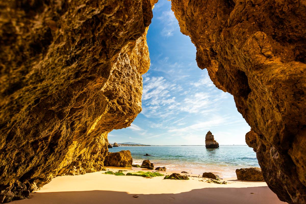 Explore the coves of Camilo Beach in Lagos.