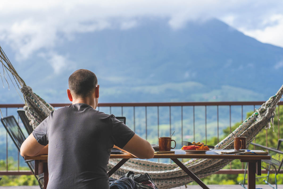 A digital nomad enjoying breakfast with a view.