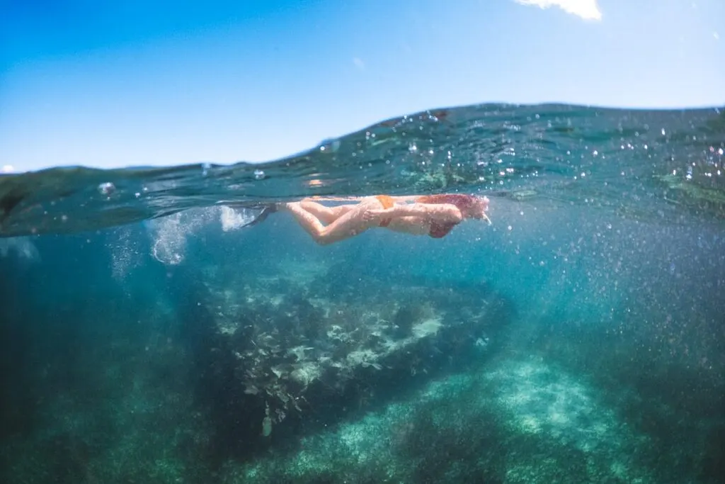 Snorkeling in Caye Caulker at a sunken barge.