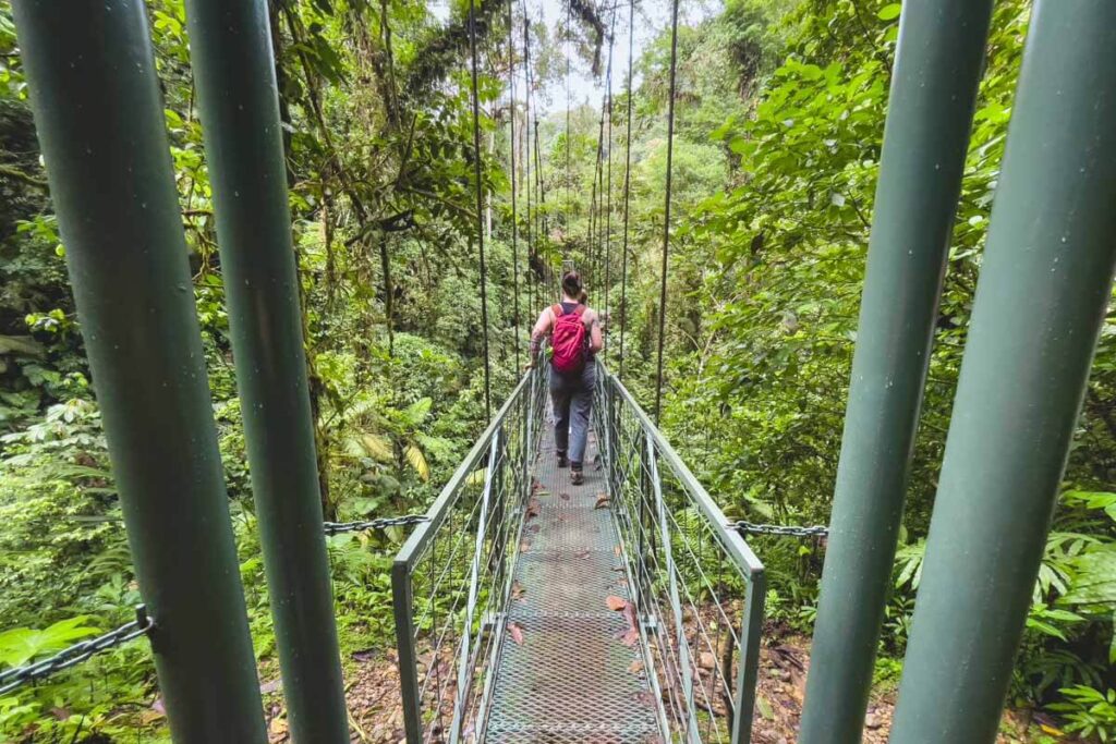 People walking across the bridge to La Fortuna waterfall.