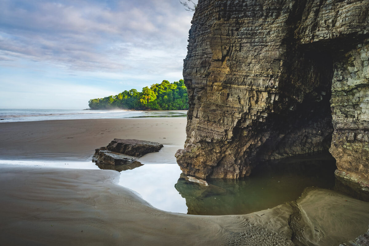 A cave in the rocks at Playa Arco beach in Costa Rica.