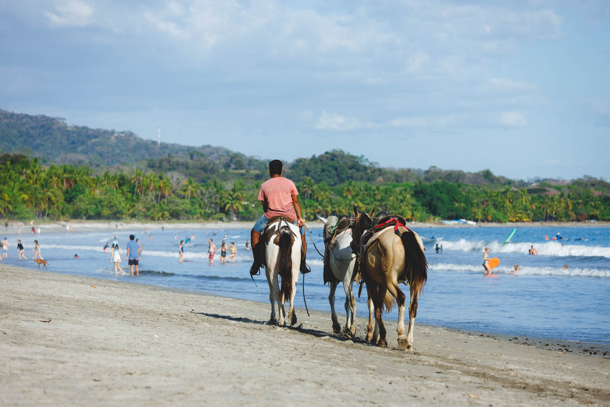 A Costa Rican man offering horseback riding at Samara Beach.