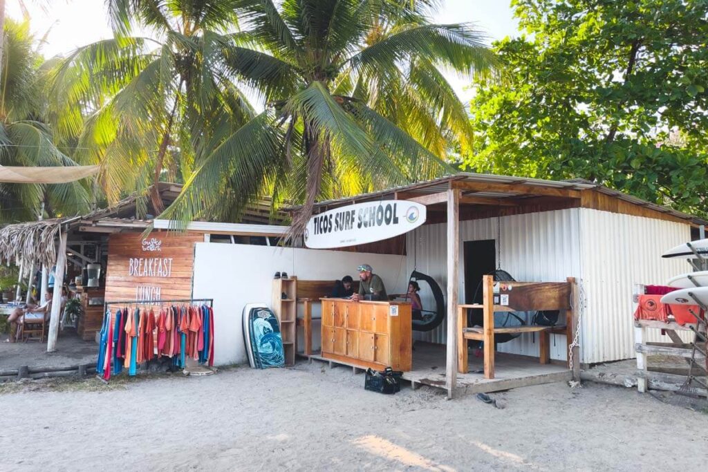 People working at Tico's Surf School at Samara beach.