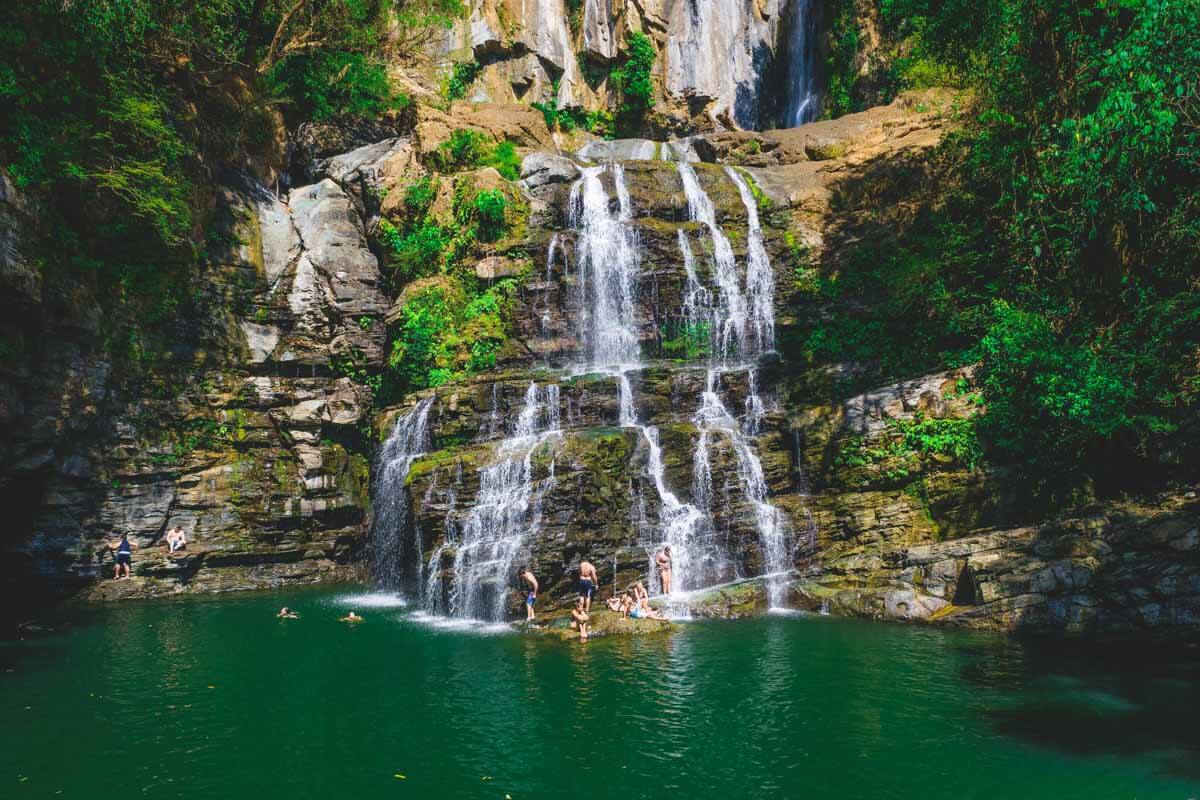 A group of tourists at Nauyaca Waterfall.