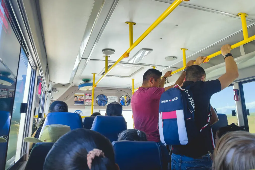 Travelers and locals inside a public bus in Costa Rica.