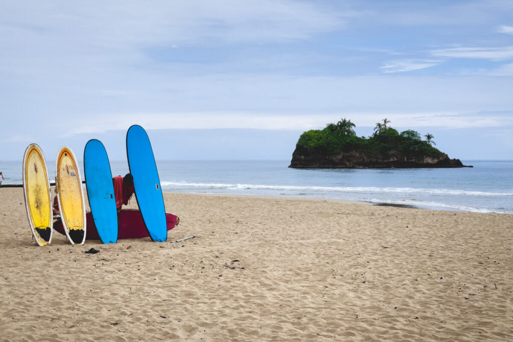 Surfboards available for rent on Playa Cocales.