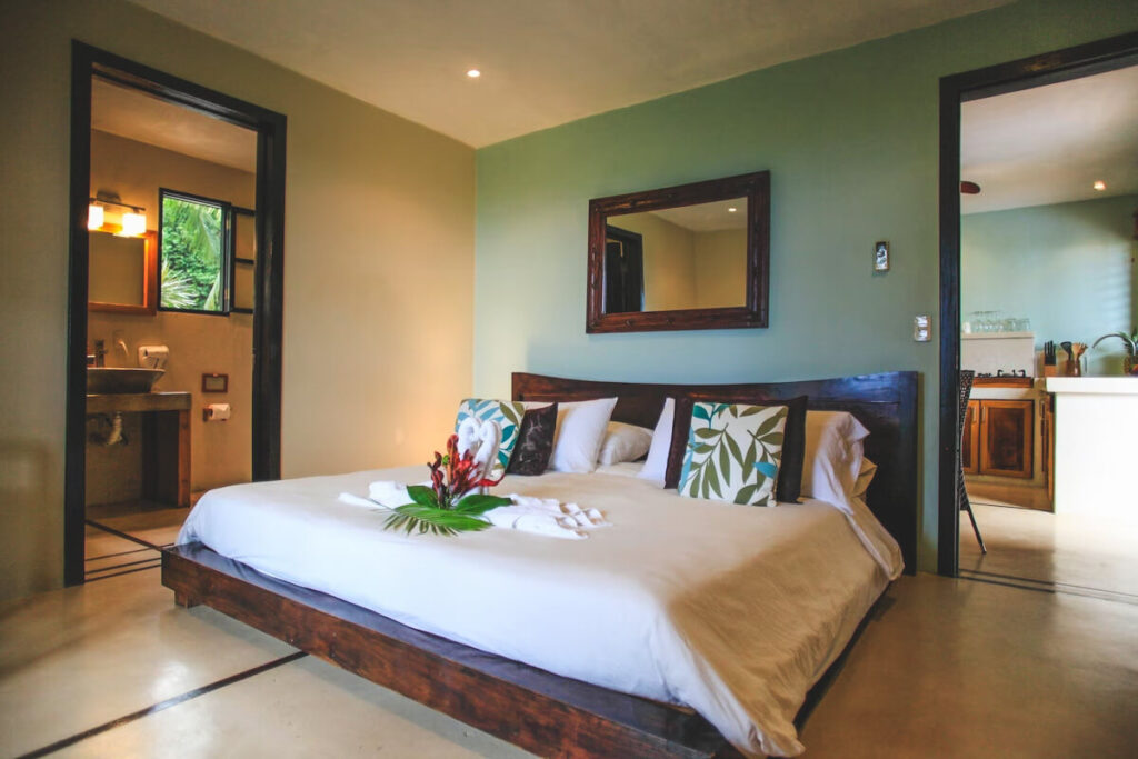 A huge king bed in Casa Marbella in Santa Teresa.