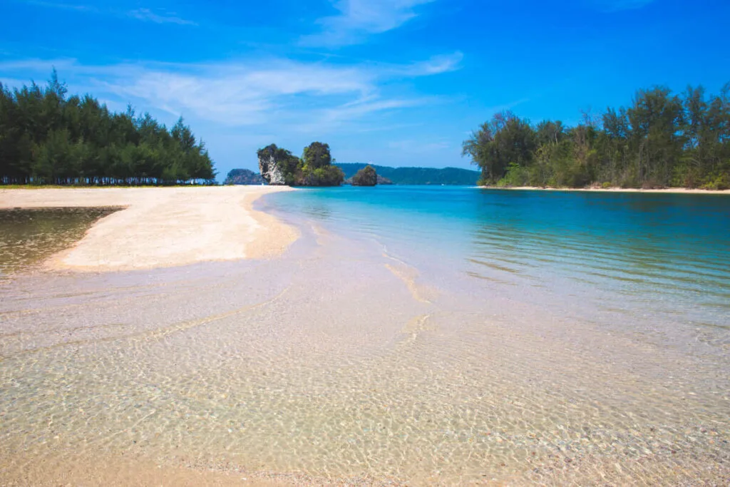 Crystal clear waters at the end of the white sand Nopparat Thara Beach in Krabi.