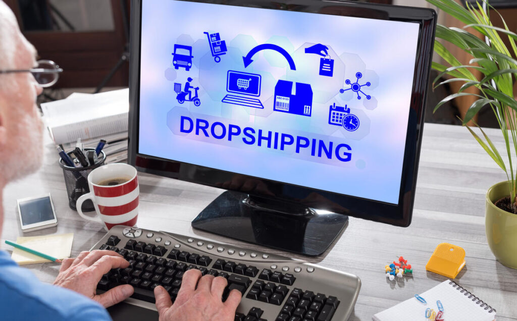 Drop shipping words on a computer showing it as a digital nomad job
