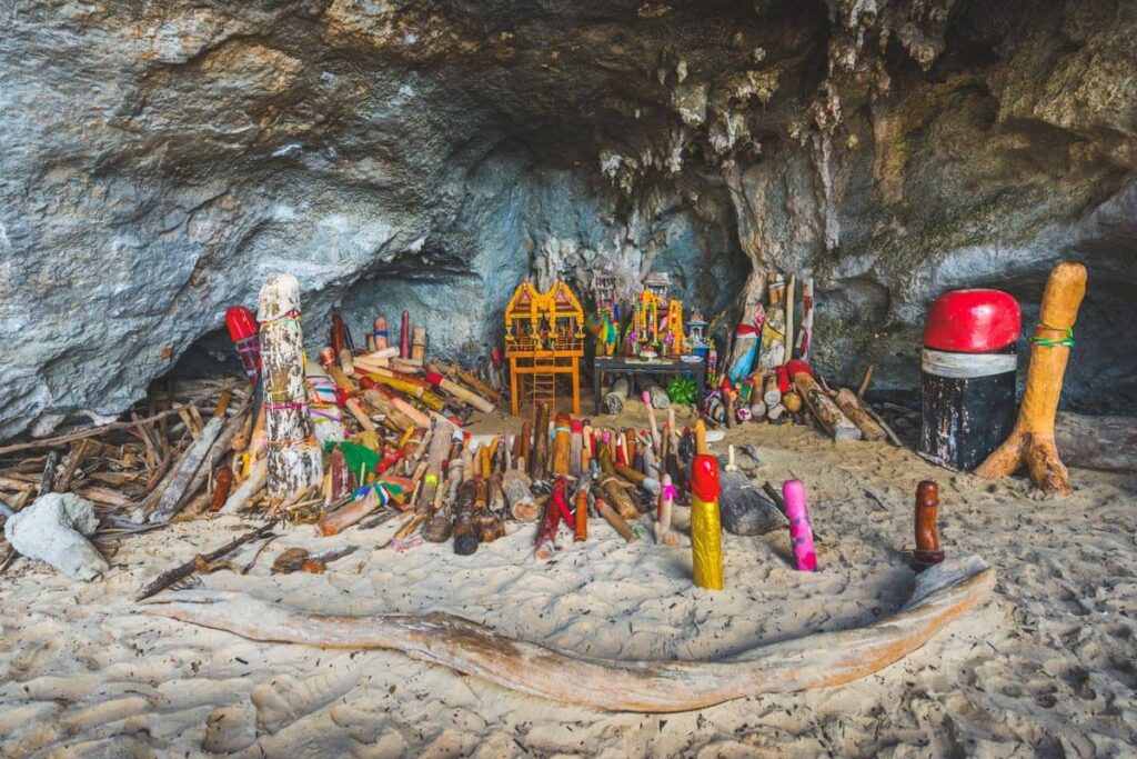 A shot depicting hundreds of multi-colored wooden phallus objects in the Princes Cave found on Phra Nang Beach on Railay.