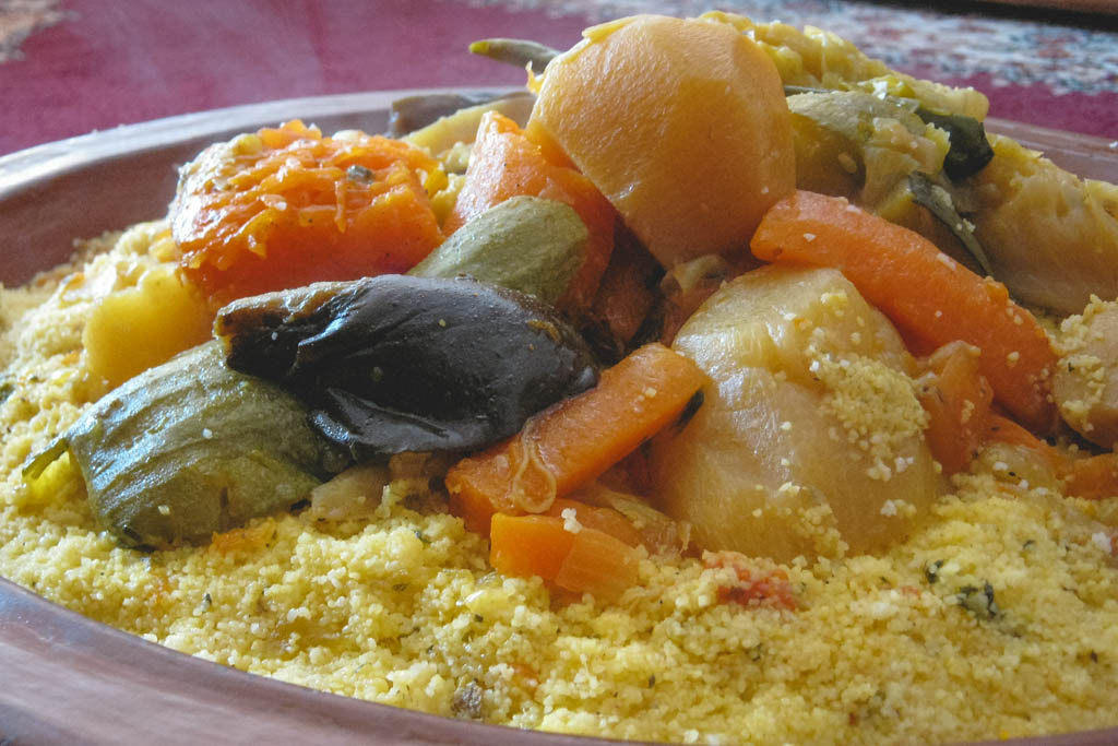 Nina and Garrett eating couscous on a friday in Morroco. 