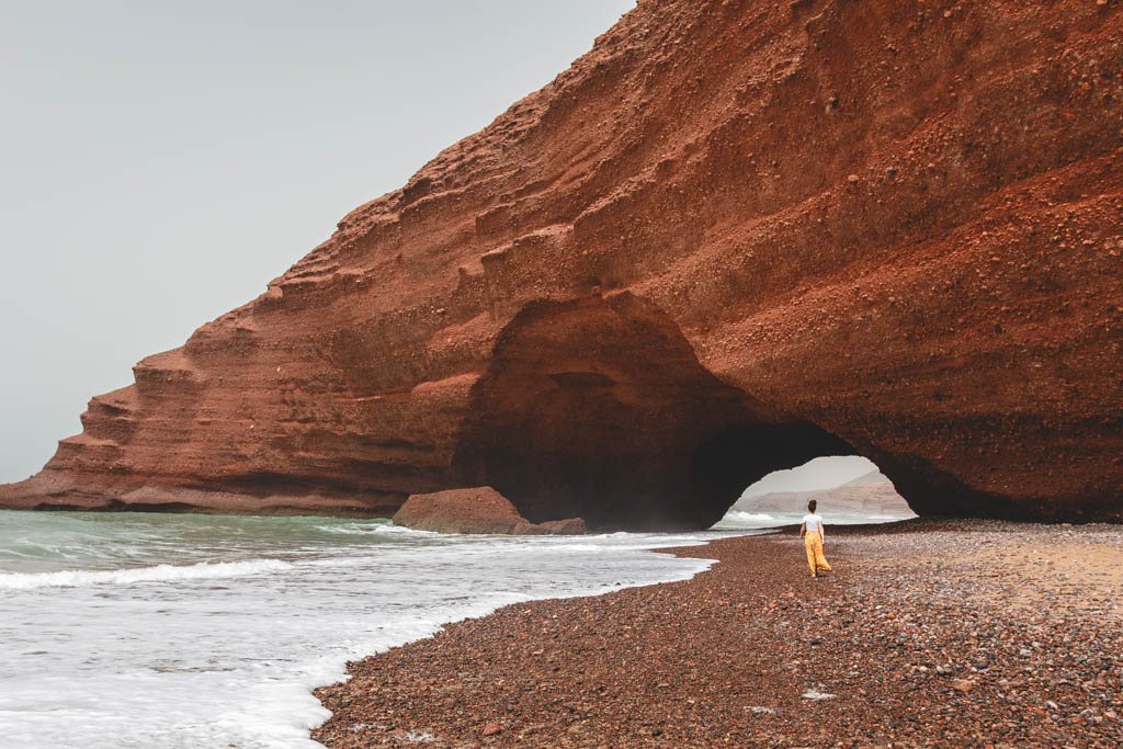 Nina walking through the massive Legzira arch in Morocco. 