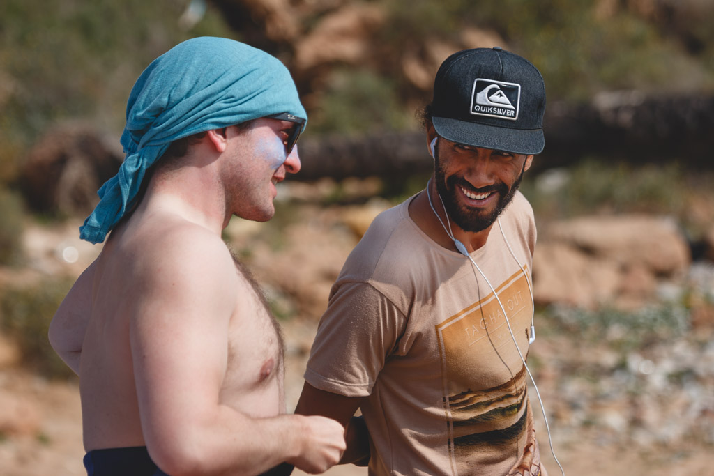 A local Moroccan surf instructor chatting up tourist.