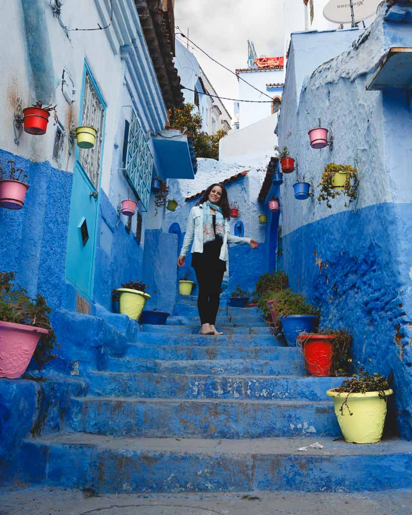 Nina walking down the famous instagram stairs of Callejon el Asri in Morocco.