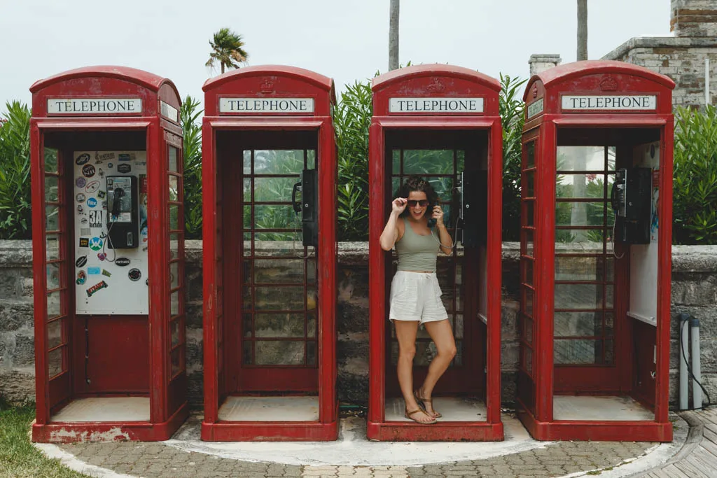 Me having a bit of fun at the old British phone booths while searching for good eats in Bermuda.