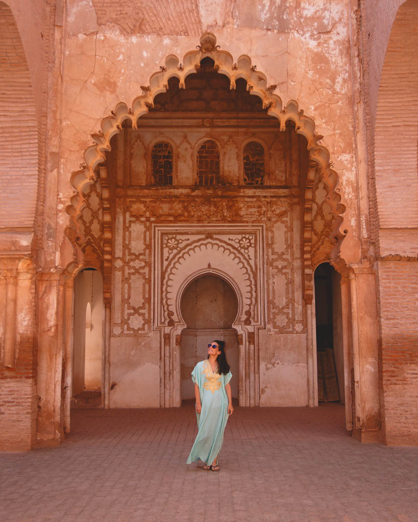 Nina in a gree dress in Tin Mel, an abandoned but beautiful mosque in Morocco