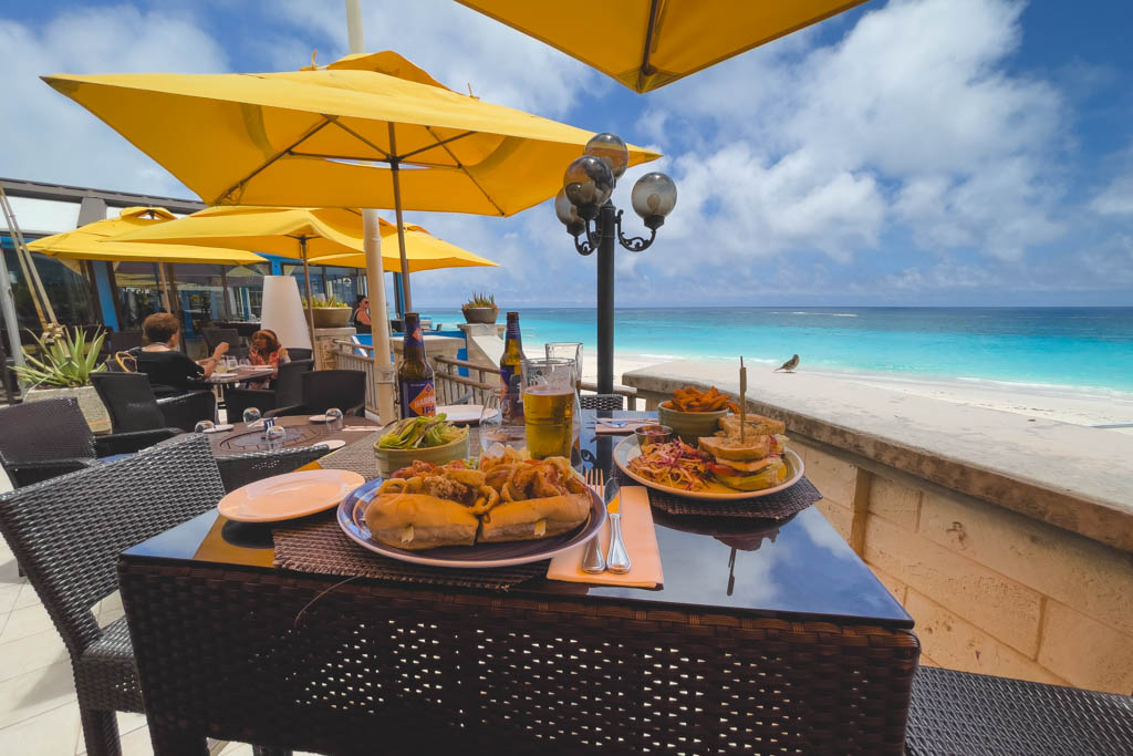 Beach side outdoor seating at Sea Breeze Restaurant in Bermuda.
