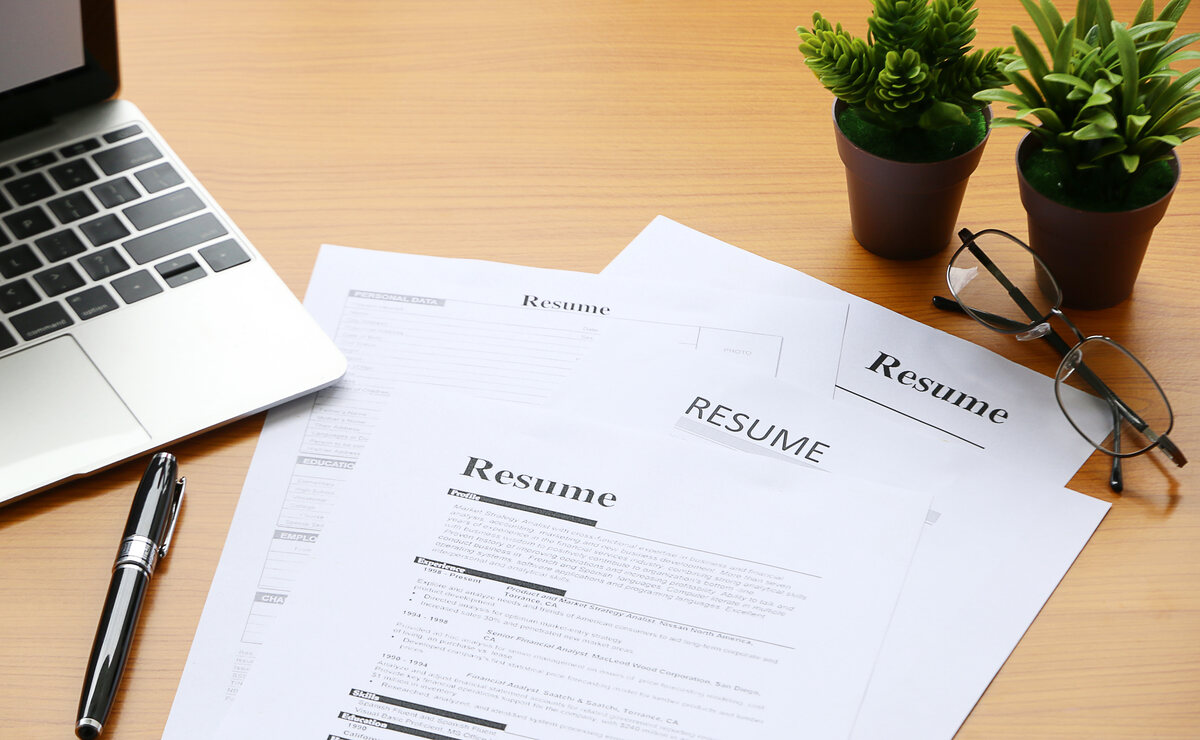 A resume for working abroad in Europe as a foreigner on a desk.