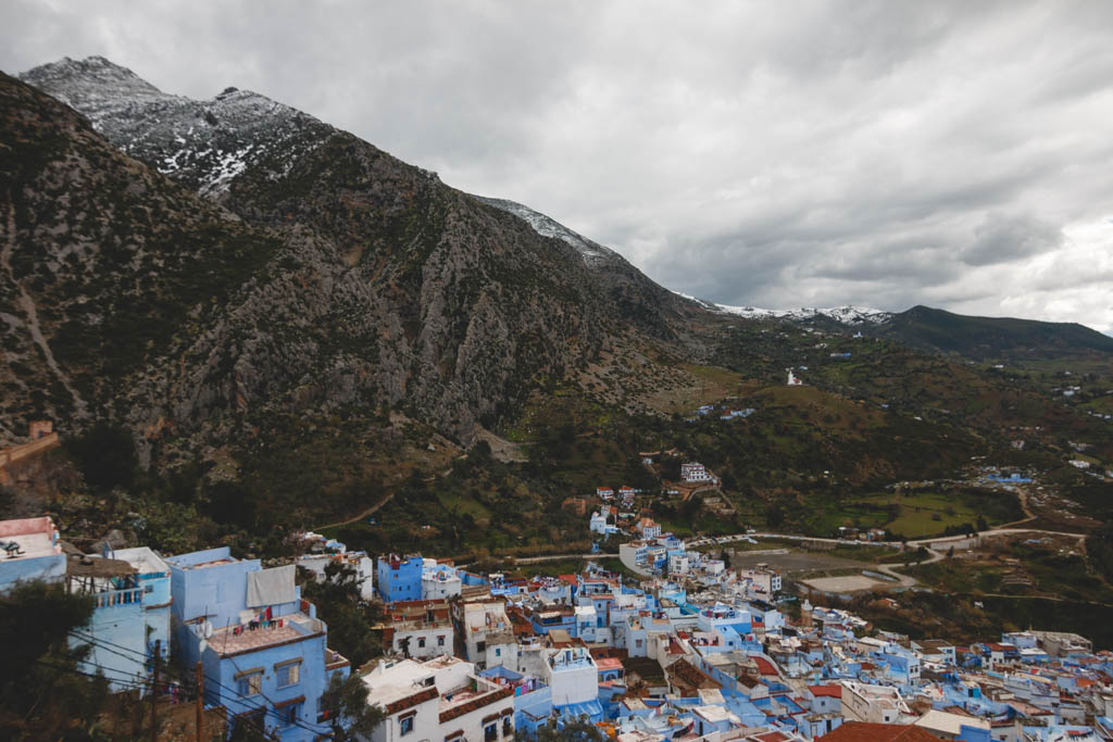 View of the snow capped mountains of the north in the blue city.