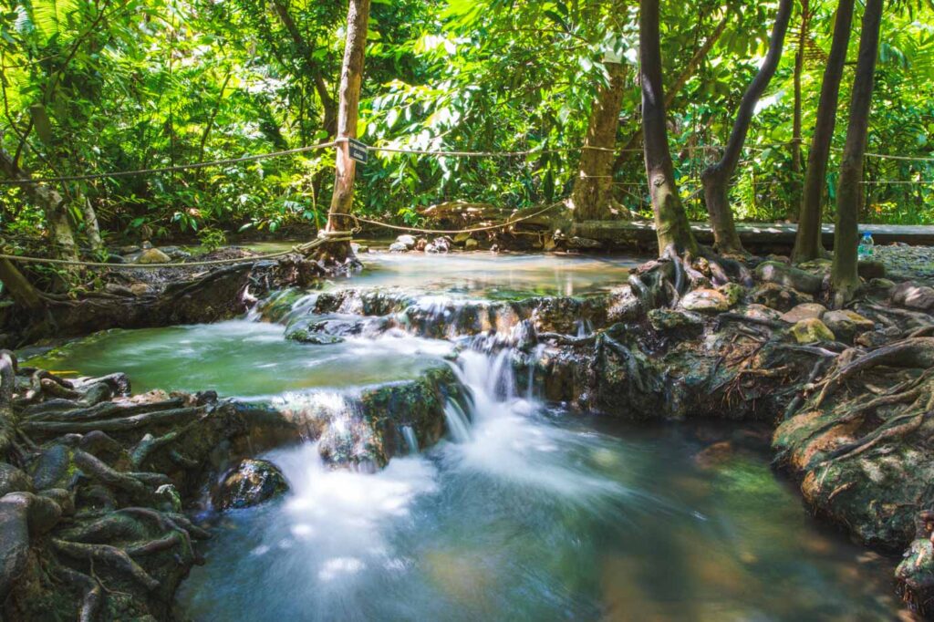 Long exposure of a hot spring waterfall in the forests of Khlong Thom Nuea.