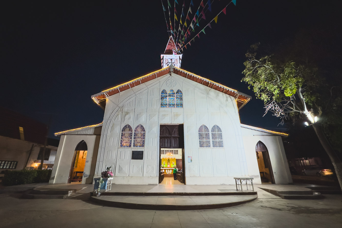 The white exterior of Inglesia Santa Barbara in Santa Rosalia lit up at night. The white exterior of Inglesia Santa Barbara in Santa Rosalia lit up at night.