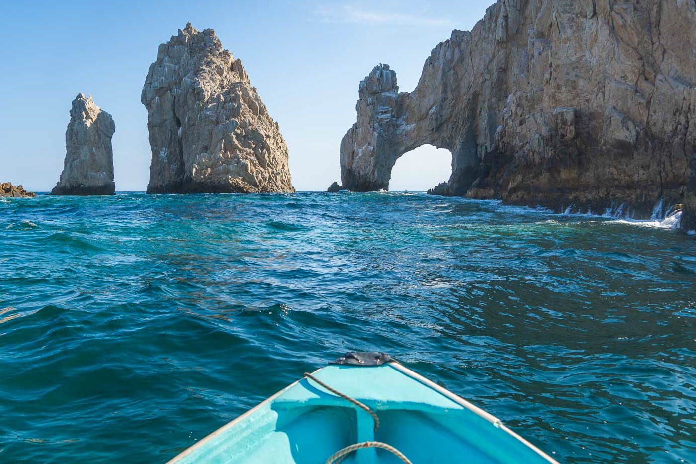 Kayaking besides Cabo Arches in a cliff face. Kayaking besides Cabo Arches in a cliff face.
