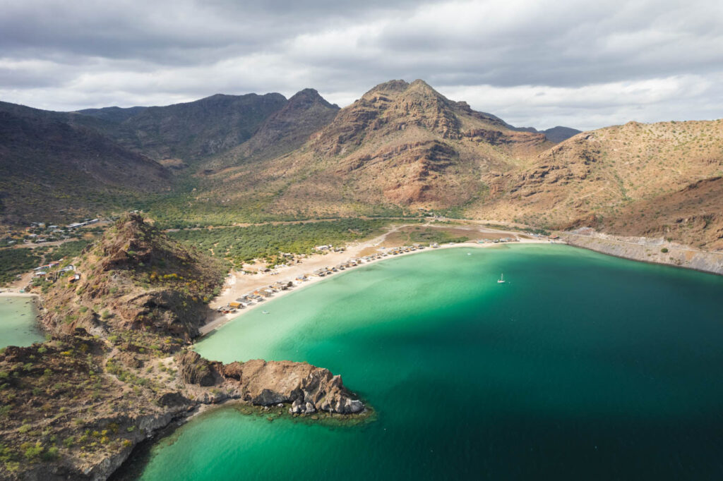 Aerial view over Playa el Burro surrounded by the mountains of Baja Sur.