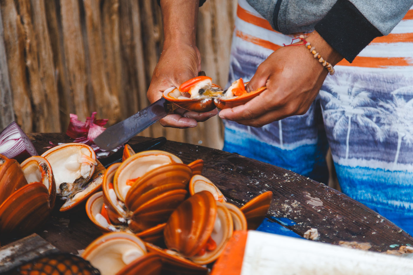Man preparing clams for seafood. Man preparing clams for seafood.