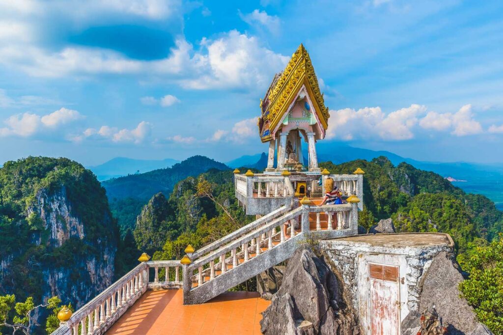 Golden Thai-style temple on top of a mountain at the Tiger Cave Temple near Krabi.