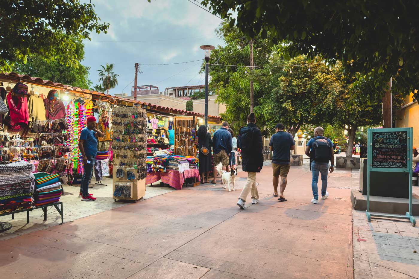 Tourist walking through Loreto's shopping market.