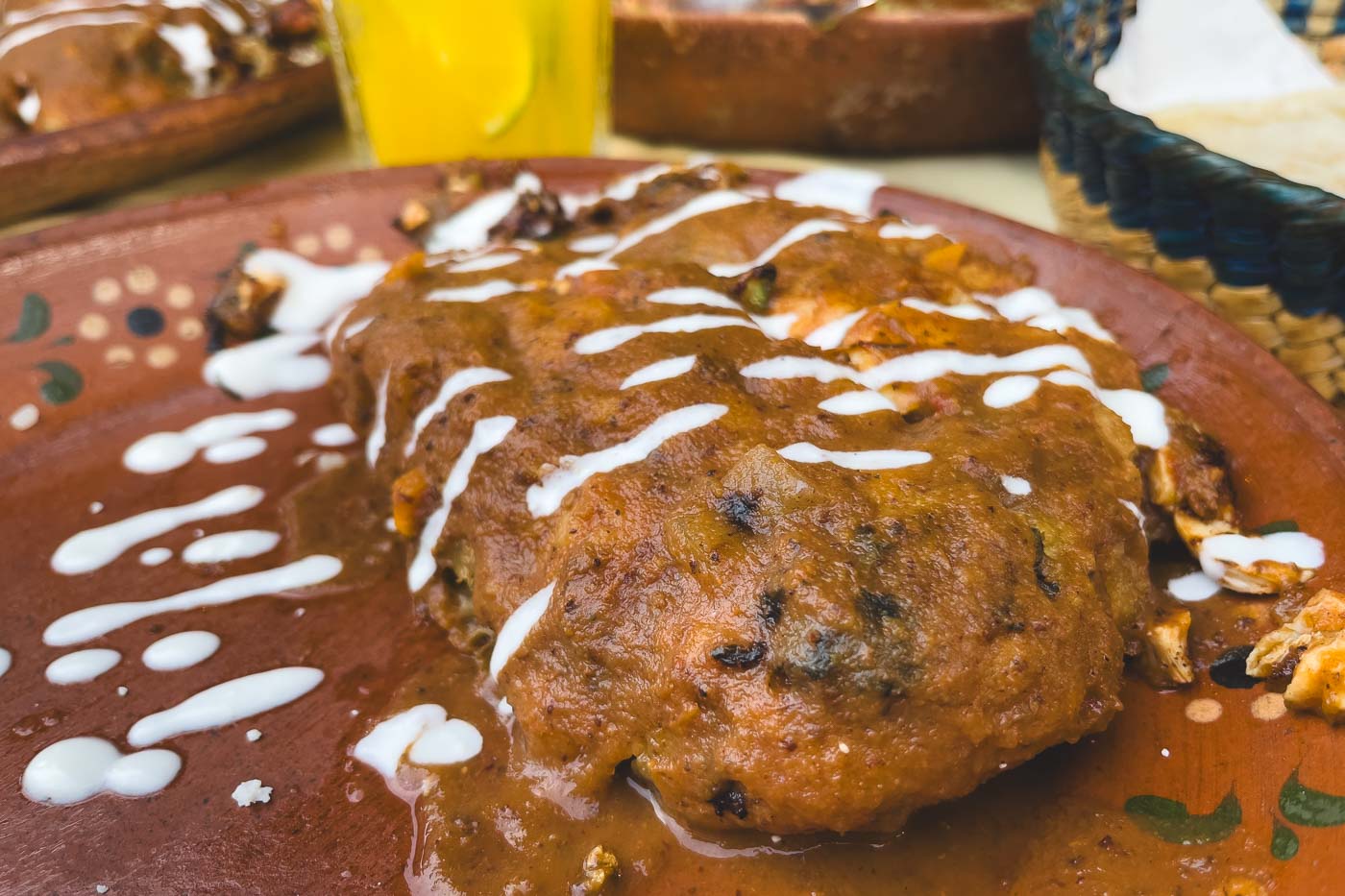 Close up of their special chile rellenos smothered in red sauce at Casa De Chile Relleno restaurant.