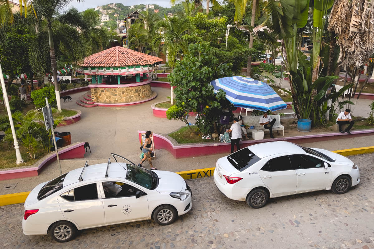 Two taxis at the taxi area in central Sayulita.