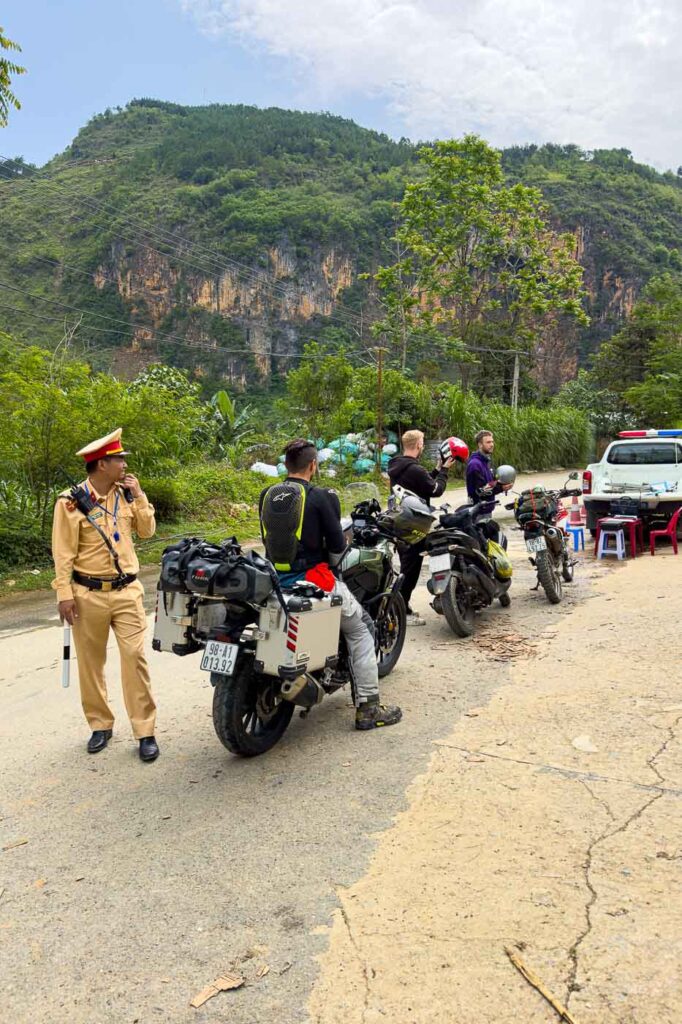 Police pulling us over while driving on Ha Giang.