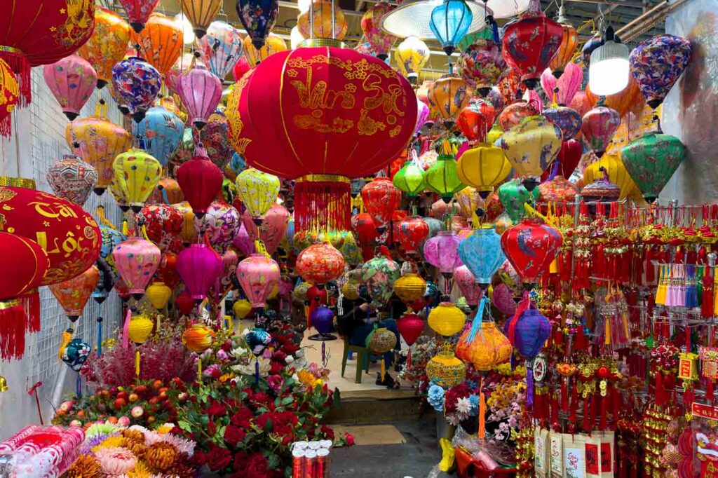 Colorful street shop in Hanoi with lots of red and other color lanterns.