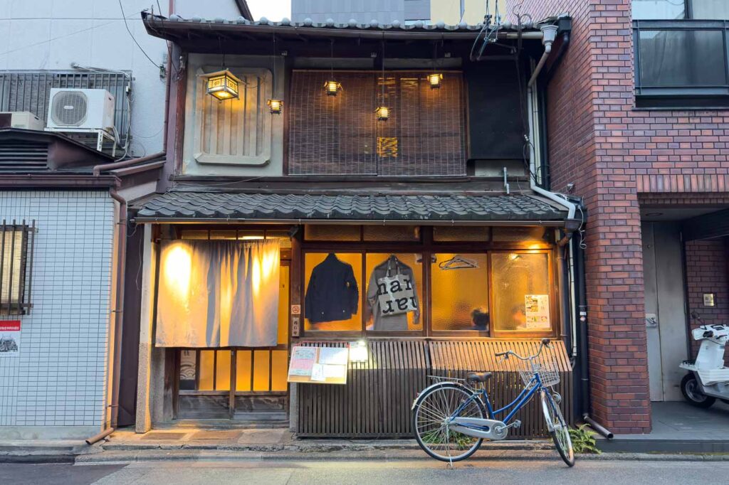 Kyoto home from the outside with a bike to the right of the door.