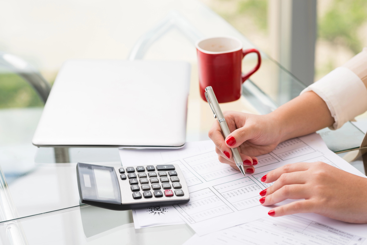 Woman using a calculator.