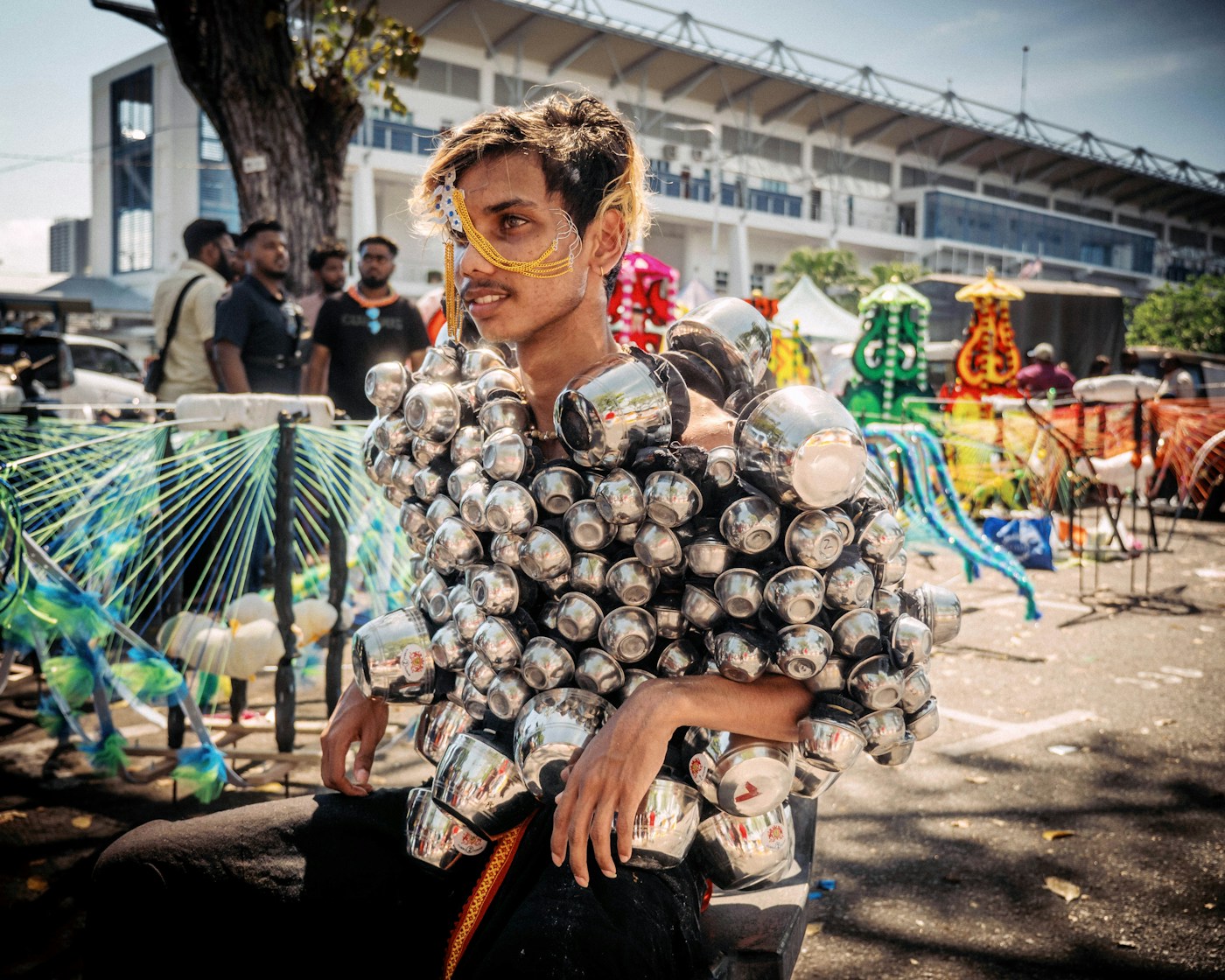 a man with a bunch of balls on his shoulders