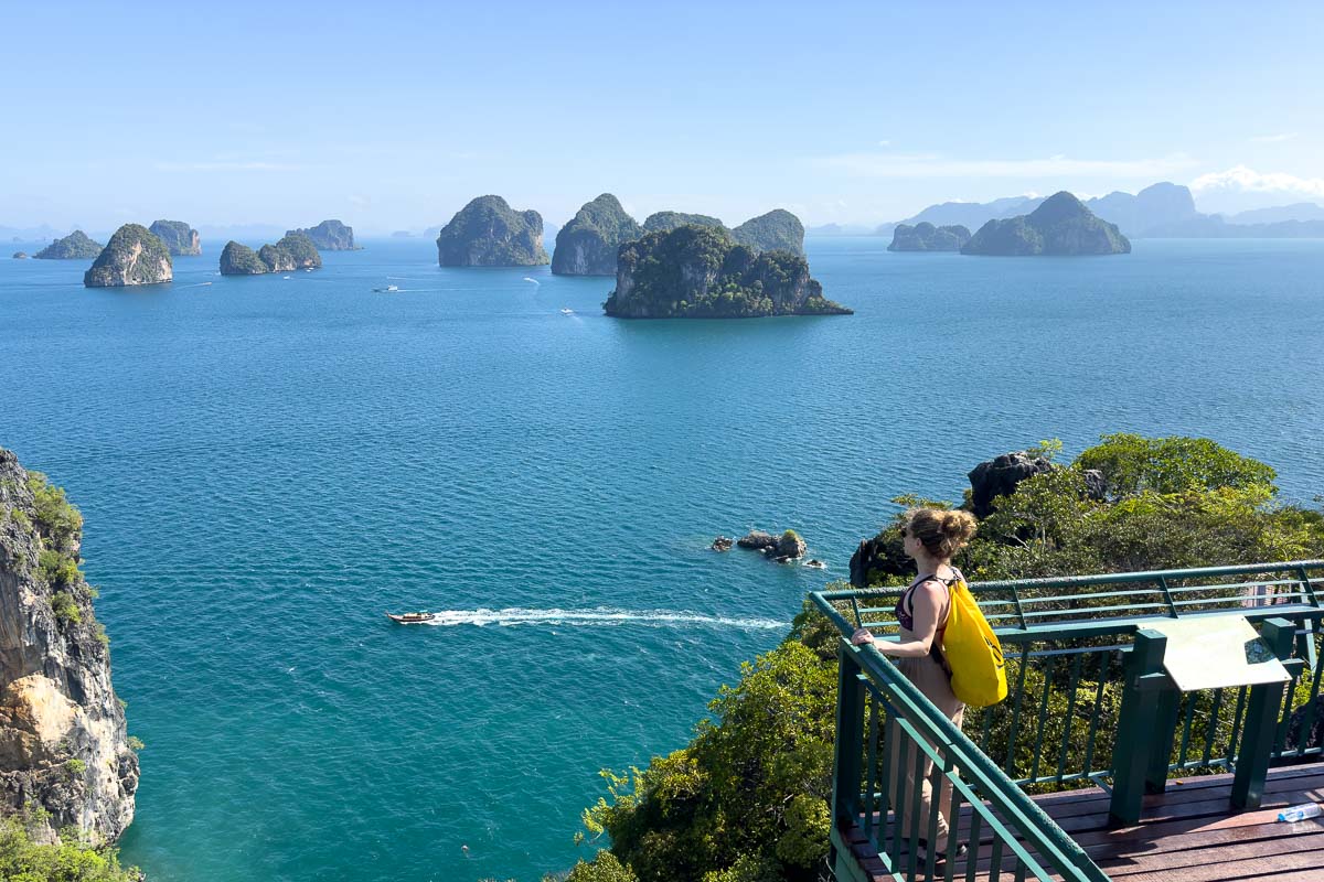 Nina at the hong Island viewpoint with islands in the water for a view.