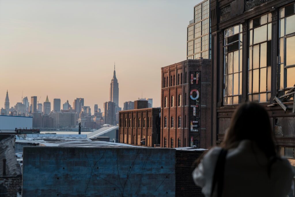 woman taking photo of buildings