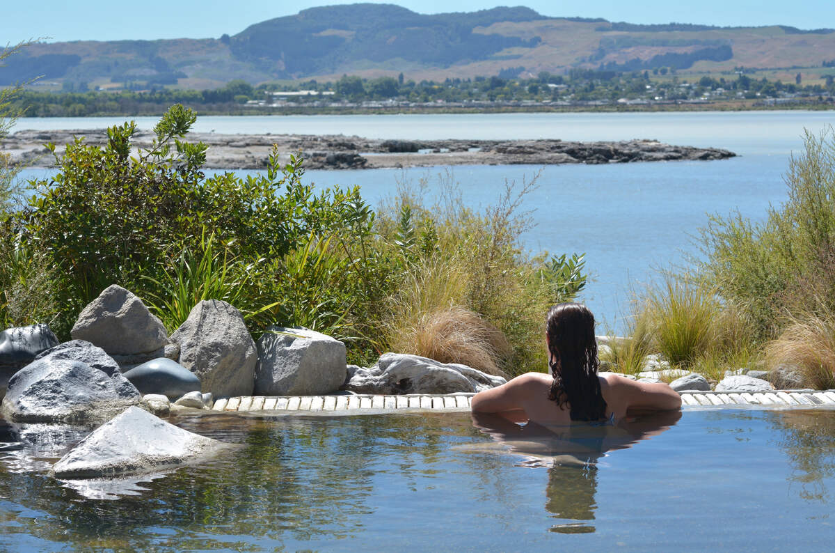 Rotorua spa with woman in water.