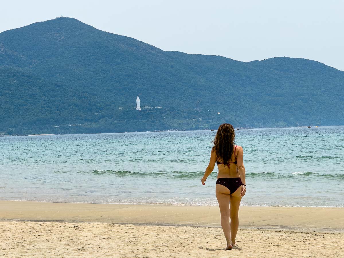 Nina walking on beach in Da Nang.
