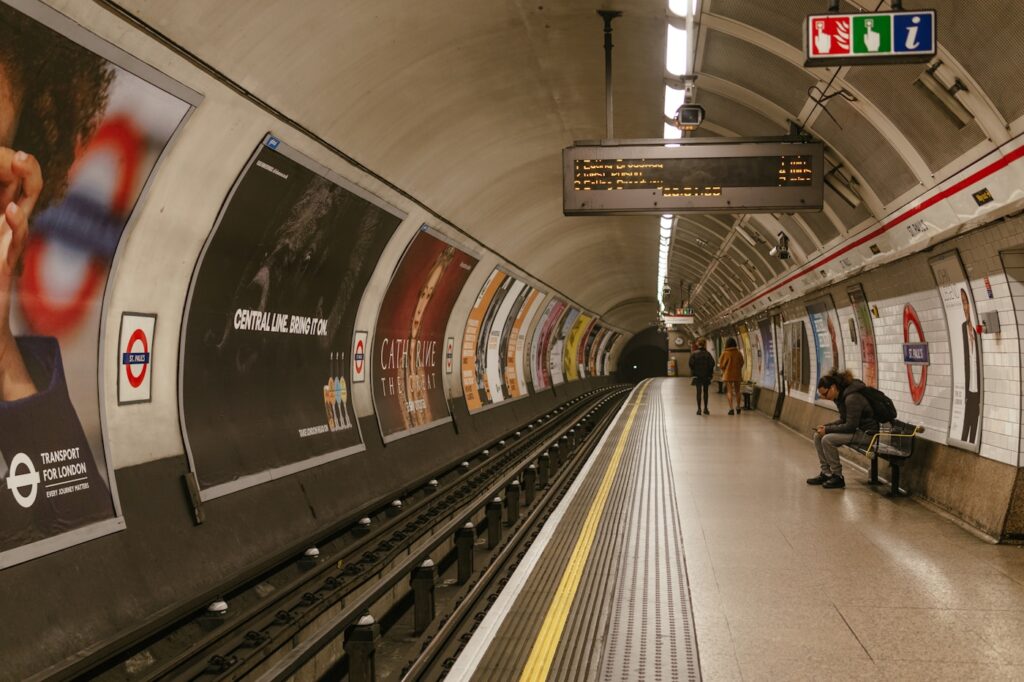 a train station with people waiting