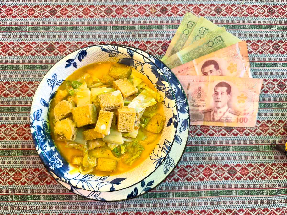 Khao soi bowl with baht.