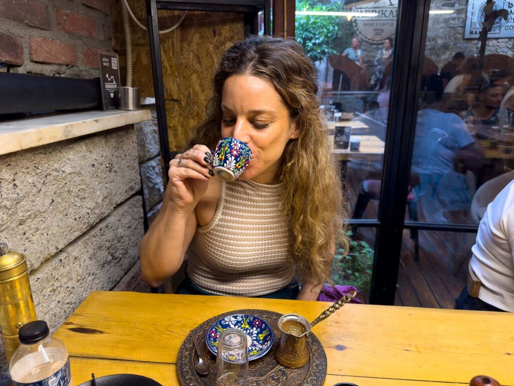 Nina drinking coffee in coffee making class on a rainy day in Istanbul