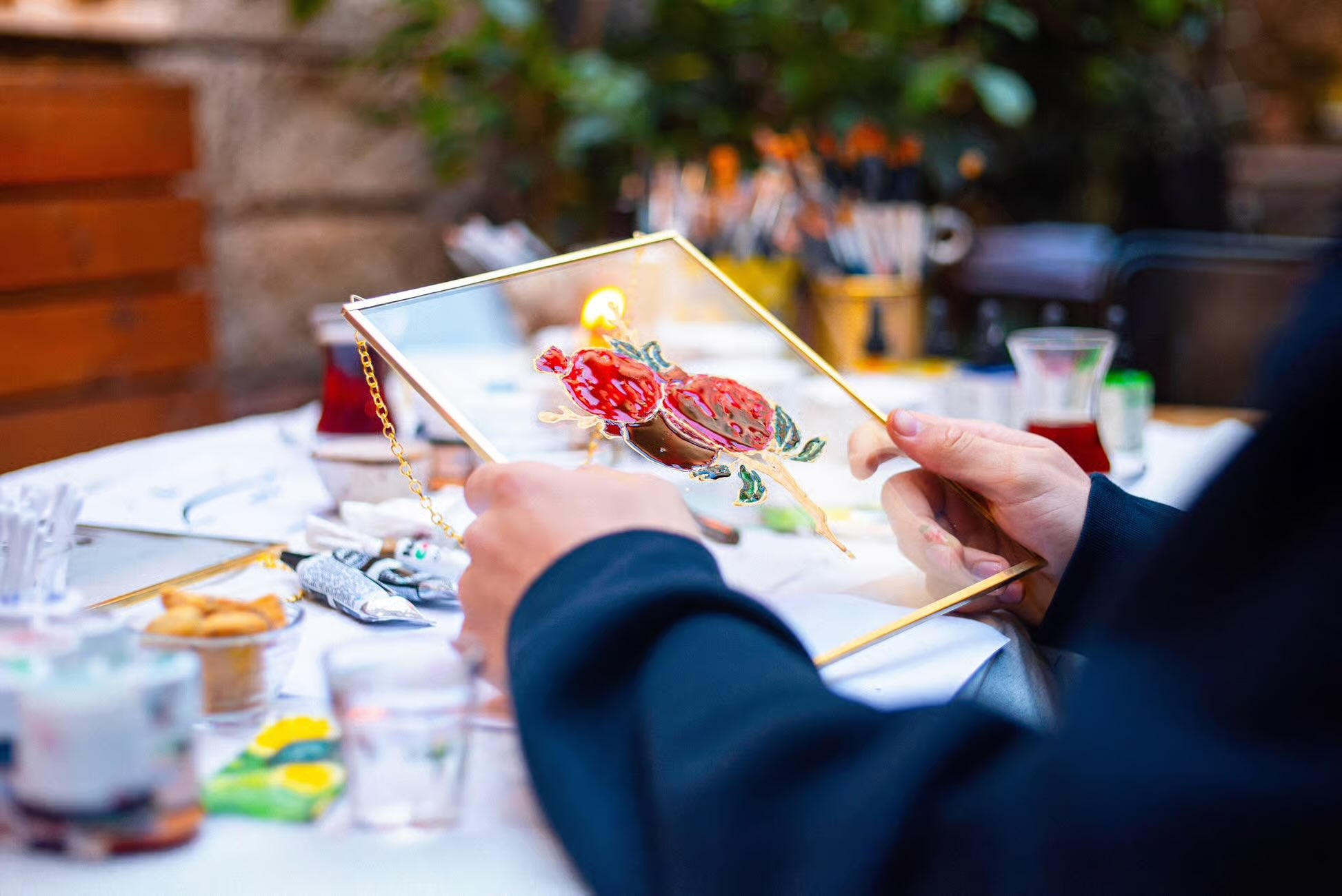 Person holding up stain glass.
