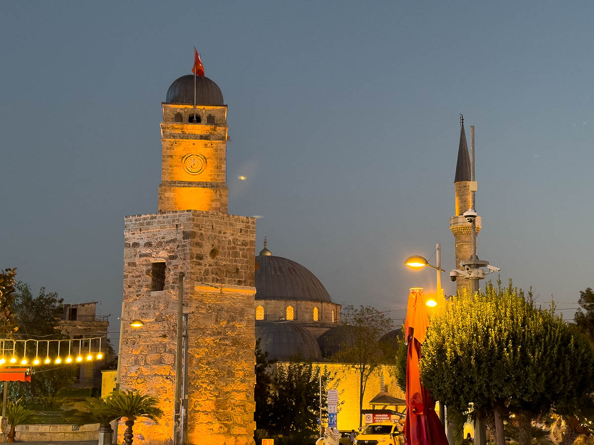 Clocktower and fortress at night in Antalya.
