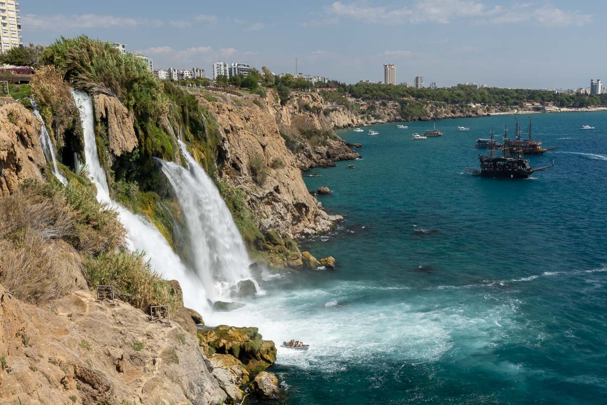 Duden Park Monument waterfall spilling into ocean.