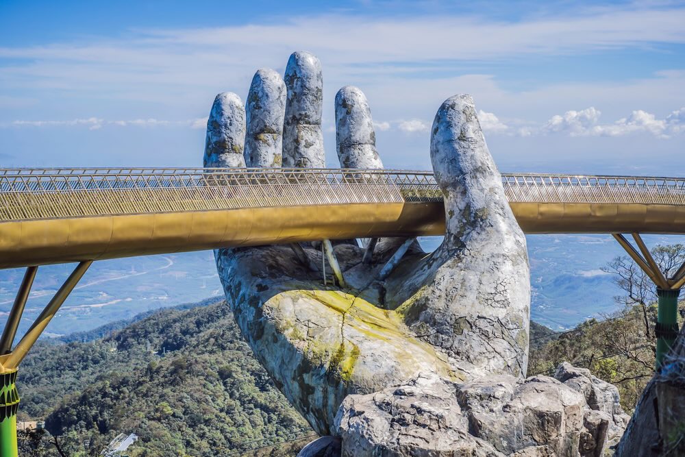 Famous tourist attraction - Golden bridge at the top of the Ba Na Hills, Vietnam.