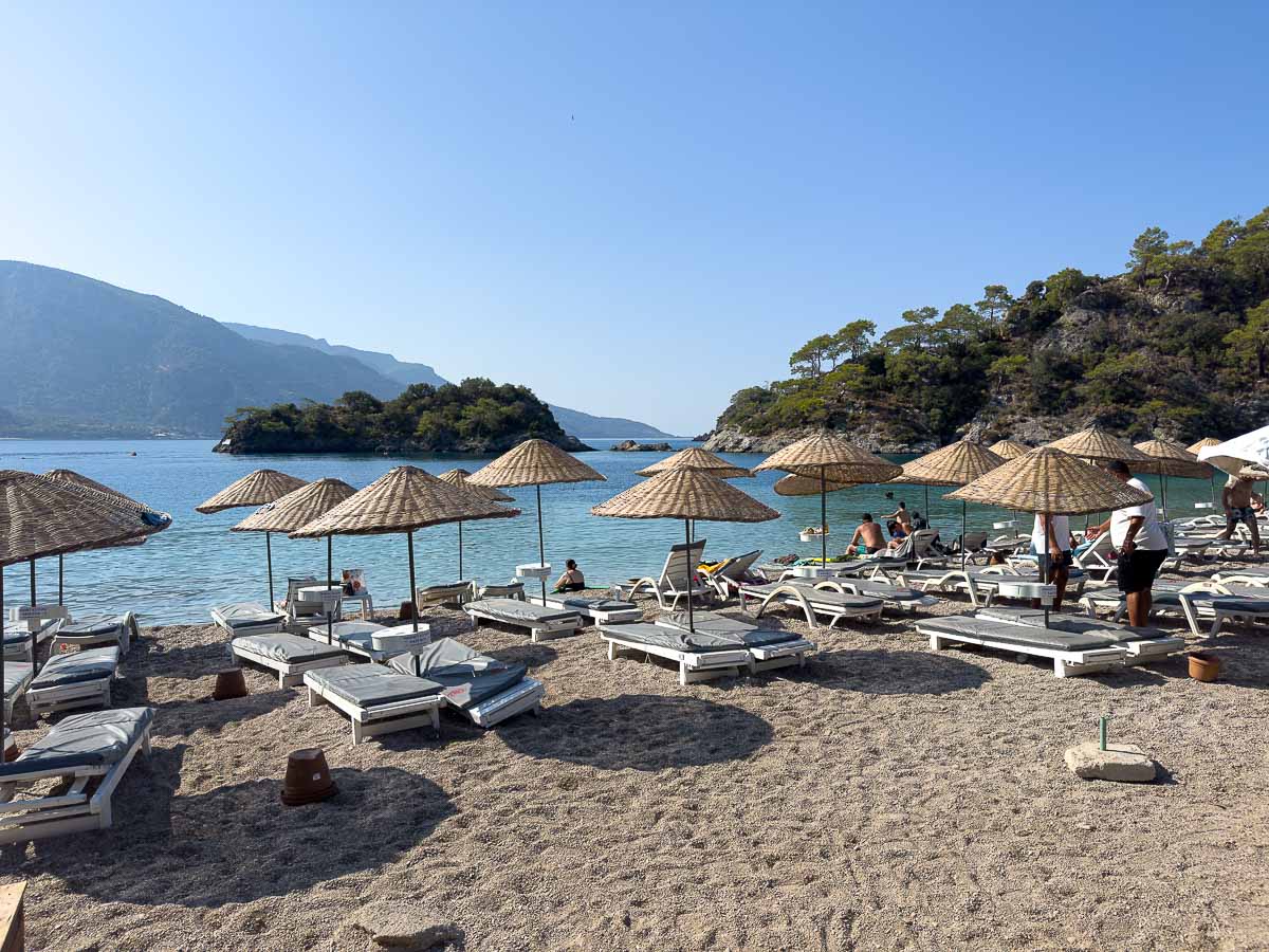 Blue Lagoon beach in Oludeniz with white bech chairs.